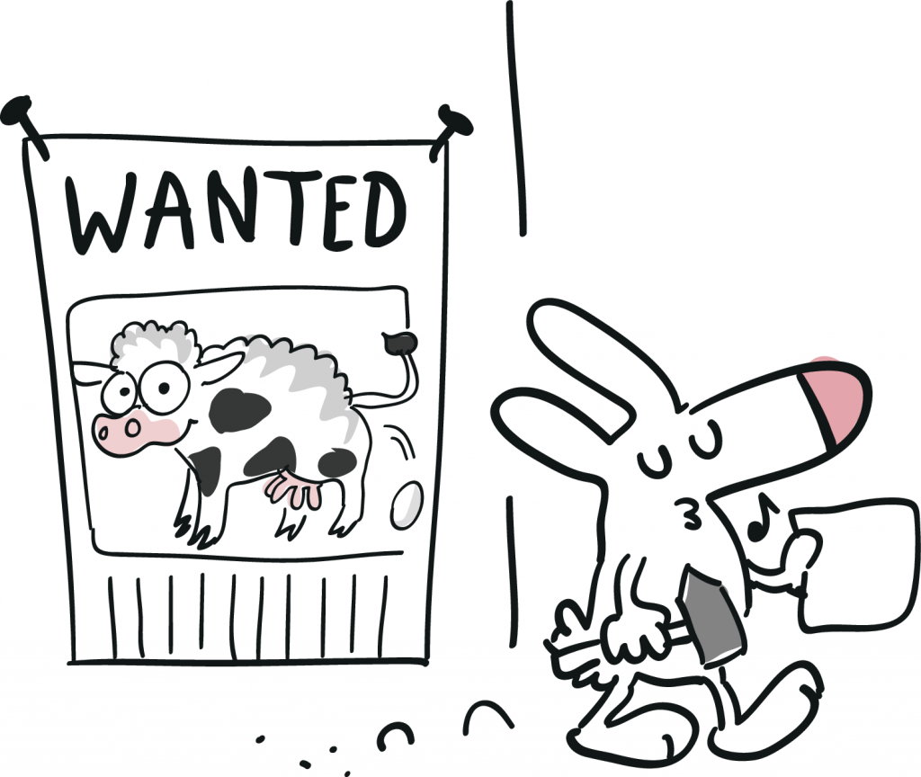 Der Hase hat ein Fahndungsplakat an eine Wand genagelt. Es trägt die Aufschrift: Wanted, und zeigt eine eierlegende Woll-Milch-Sau.